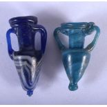 TWO GRAND TOUR ROMAN STYLE GLASS AMPHORA. Largest 5.5 cm long. (2)