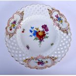 A LATE 19TH CENTURY MEISSEN PORCELAIN RETICULATED CABINET PLATE painted with flowers. 22 cm wide.
