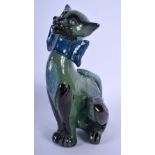 A VINTAGE CHARLES BRANNAM POTTERY FIGURE OF A CAT modelled in a bowtie. 27 cm x 9 cm.