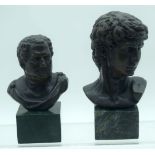 A small bronze bust of Caesar on a plinth together with another. 18cm (2)