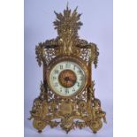 AN ANTIQUE FRENCH BRASS MANTEL CLOCK formed with figures and foliage. 36 cm x 15 cm.