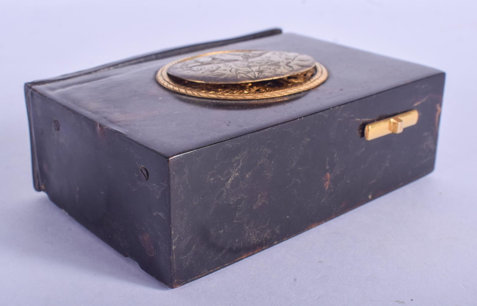 A MID 19TH CENTURY EUROPEAN TORTOISESHELL AUTOMATON SINGING BIRD BOX engraved with birds and vines.