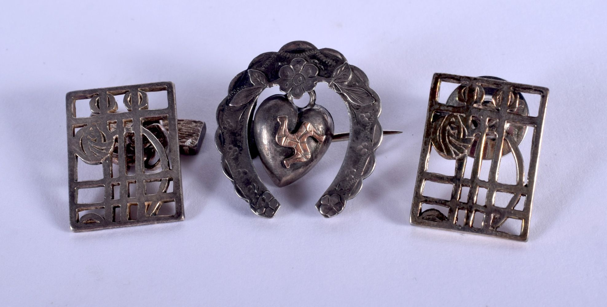 A PAIR OF RENNIE MACKINTOSH SILVER CUFFLINKS and a brooch. 10 grams. (3)