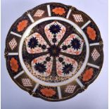 Royal Crown Derby six footed low comport painted with imari pattern 1128, date code 1924. 21.5cm d