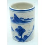 A Chinese blue and white brush pot decorated with a mountainous Landscape 14cm.