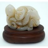 A Carved Jade boulder on a wooden stand in the form of a crouching figure 7cm (2)