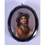 AN ANTIQUE JET AND PORCELAIN PORTRAIT BROOCH. 5.5 cm x 3.5 cm.