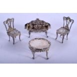 FOUR PIECES OF SILVER DOLLS HOUSE FURNITURE. Birmingham 1976. 54 grams. Largest 6 cm x 5 cm. (4)