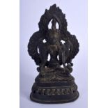 A 19TH CENTURY INDO TIBETAN NEPALESE BRONZE FIGURE OF A BUDDHA modelled with a flaming surround. 17