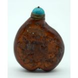 A Chinese Snuff bottle decorated in relief with a tiger and bats . 7.5cm .