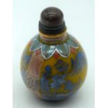 A Chinese snuff bottle decorated with figures in a landscape 7cm.