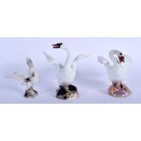 THREE 19TH CENTURY MEISSEN PORCELAIN FIGURES OF SWANS modelled upon naturalistic bases. Largest 11 c