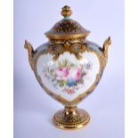 A FINE ROYAL CROWN DERBY TWIN HANDLED VASE AND COVER by Desire Leroy, painted with foliage. 14 cm x