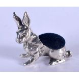 A SILVER RABBIT PIN CUSHION. 10 grams. 3 cm x 3 cm.