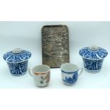 A pair of small Japanese lidded pots, a carved hardstone plaque and two Chinese tea cups 17cm (7).