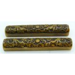 A pair of carved hardstone scroll weights 21cm (2) .
