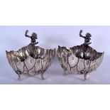 A PAIR OF EARLY 20TH CENTURY SILVER CHERUB BOWLS formed as open flowers. 640 grams. 13 cm x 15 cm.