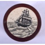 A CARVED WOOD MARITIME BOX AND COVER. 5 cm diameter.