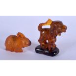 TWO CHINESE CARVED AMBER ANIMALS 20th Century. 23 grams. Largest 5 cm x 2.5 cm. (2)