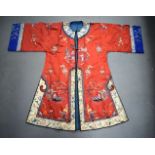 AN EARLY 20TH CENTURY CHINESE RED SILKWORK EMBROIDERED ROBE Late Qing/Republic, decorated with figur