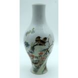 A Chinese polychrome vase decorated with birds and foliage 31cm.