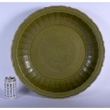 A LARGE 19TH CENTURY CHINESE CELADON BARBED LONGQUAN STONEWARE DISH Ming style, decorated with a fiv