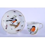 A 19TH CENTURY MEISSEN PORCELAIN CUP AND SAUCER painted with birds amongst foliage. 13.5 cm wide.