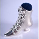 A SILVER BOOT PIN CUSHION. 17 grams. 4 cm x 4.5 cm.