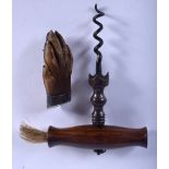 AN ANTIQUE CORKSCREW and an antique claw brooch. Largest 14 cm long. (2)