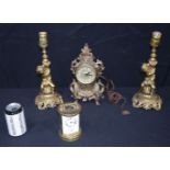 A Marianne Clock together with a carriage clock and gilt metal candle sticks (4).