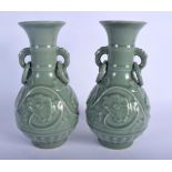 A PAIR OF 19TH CENTURY CHINESE TWIN HANDLED CELADON LONGQUAN VASES Ming style, decorated with flower