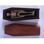 A CONTINENTAL CARVED BONE COFFIN. 8 cm long.