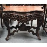A FINE 19TH CENTURY CHINESE CARVED HARDWOOD CONSOLE TABLE decorated with carp and phoenix birds. 77