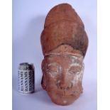 A 17TH/18TH CENTURY CHINESE CARVED RED STONE HEAD OF AN OFFICIAL Ming/Qing. 30 cm x 15 cm.