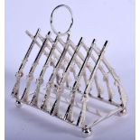 A NOVELTY SILVER PLATED RIFLE TOAST RACK. 11 cm x 11 cm.