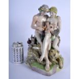 A VERY RARE 19TH CENTURY COPENHAGEN PORCELAIN FIGURE OF A MALE AND FEMALE modelled nudge beside a po