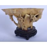 A LATE 18TH/19TH CENTURY CHINESE CARVED SOAPSTONE LIBATION CUP Ming style, overlaid with foliage. 19
