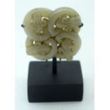 A Chinese Jade Plaque on a stand decorated with snakes 5cm.(2)