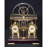 A Contemporary steam engine clock set on a wooden base 52 x 26cm.