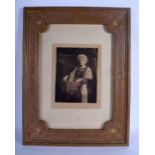 A LARGE ANTIQUE TOOLED LEATHER PHOTOGRAPH FRAME inset with a photograph of Miss Hamilton Kidston (Si