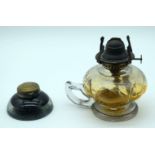 A small Victorian glass aladdin oil lamp base together with a glass lidded glass inkwell. 14cm (2)
