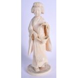 A 19TH CENTURY JAPANESE MEIJI PERIOD CARVED IVORY FIGURE OF A GEISHA modelled holding a basket. 17 c