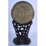 A VERY RARE 19TH CENTURY CHINESE POLISHED BRONZE MIRROR Qing, upon a hardwood scrolling stand. 27 cm