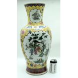 A large Chinese Famille Jaune vase decorated with figures in a landscape 63cm.