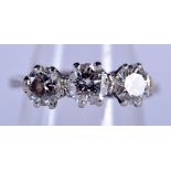 AN 18CT GOLD THREE STONE DIAMOND RING of approx 1cts. K. 3.8 grams.