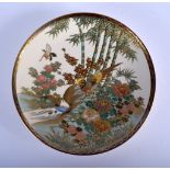 AN EARLY 20TH CENTURY JAPANESE MEIJI PERIOD SATSUMA PLATE painted with birds and foliage. 19 cm diam