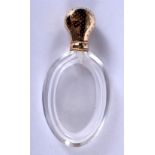 AN ANTIQUE 18CT GOLD AND CRYSTAL GLASS SCENT BOTTLE. 10 cm high.