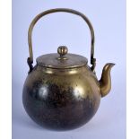 A 19TH CENTURY CHINESE POLISHED BRASS TEAPOT AND COVER Late Qing, with fruiting finial. 14 cm x 16 c