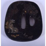 AN EARLY 20TH CENTURY JAPANESE TAISHO PERIOD SILVER INLAID BRONZE TSUBA decorated with a fox amongst