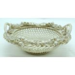 AN ANTIQUE IRISH FIRST PERIOD 'SYDENHAM TWIG' BASKET C1880 decorated with sprays of flowers. 21 cm w